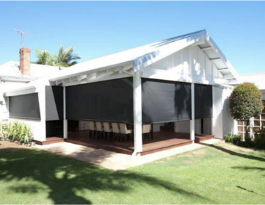 Mesh retractable patio shades on house back patio