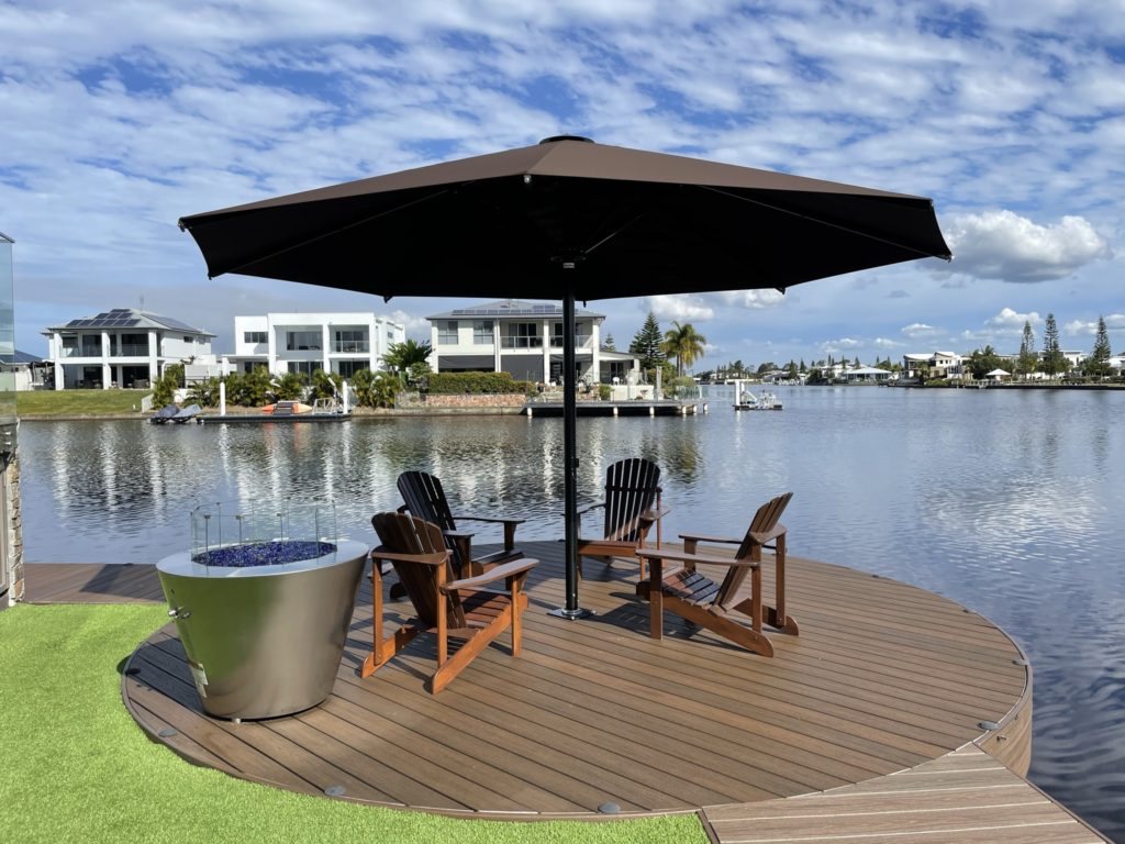 Ultrashade heavy duty umbrella providing shade over a deck near to a canal