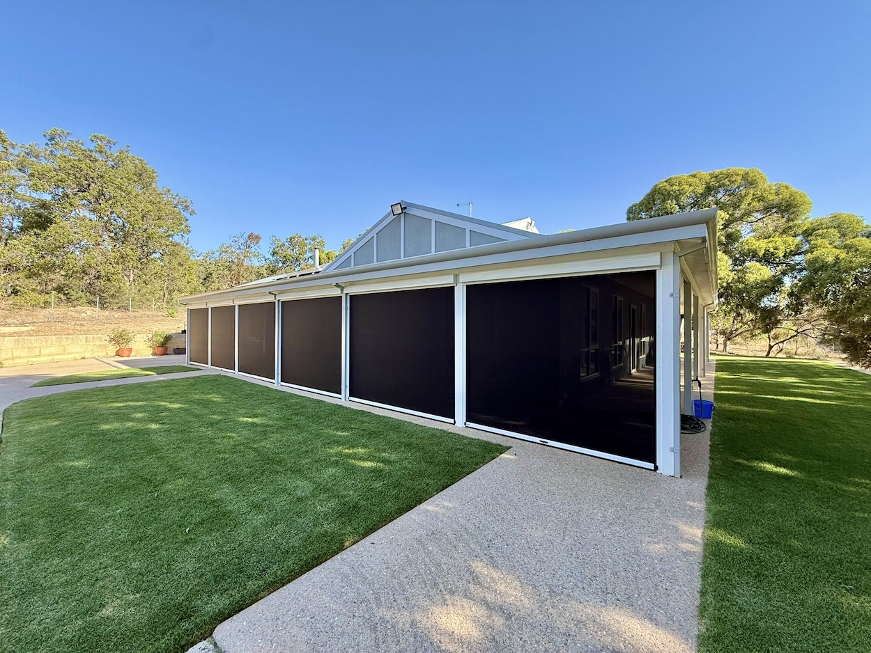 Mesh outdoor blinds providing sun and UV protection on a patio in Perth